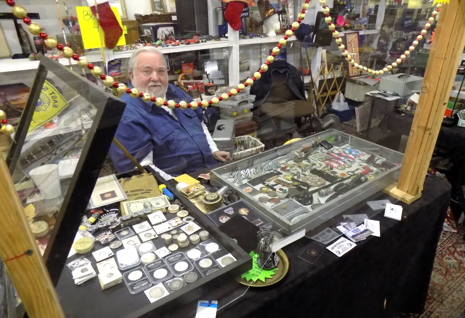 Shoppers browsing between rows of flea market stalls